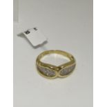 18ct gold 0.60ct diamond ring in a bow design. Hallmarked 750 London. Approx sie o, approx weight