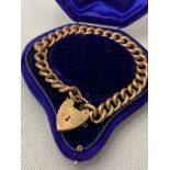 Antique 9ct gold bracelet with heart locket, hand engraved EJ 25.12.21, approx weight 28g