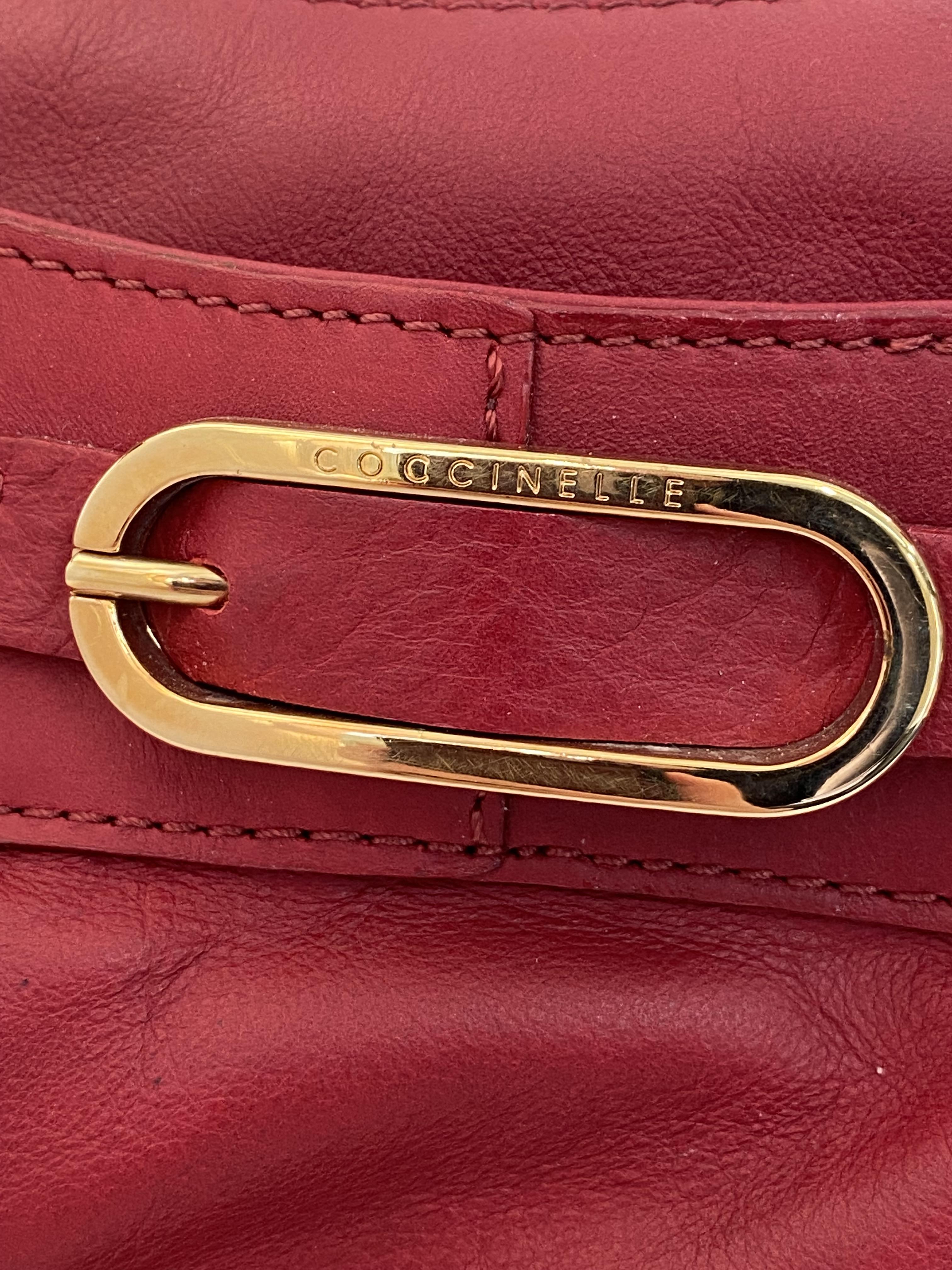 A genuine Coccinelle leather handbag featuring a striking red soft leather with contrasting gold - Image 3 of 6