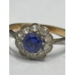 Yellow gold ring 9ct gold ring with central blue stone and clear stones, hallmarked Birmingham, size