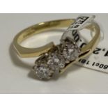 18k yellow gold 0.60ct diamond ring featuring three diamonds in an unusual design. Hallmarked 750