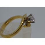 18ct yellow gold ring, with princess cut diamond in a raised swirl mount, approx size N
