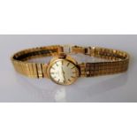 A mid-20th century ladies Omega dress watch with 9ct gold case and strap, hallmarked, inscribed,
