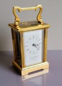 A Mappin & Webb brass carriage clock, in working order, 15 cm H, including handle