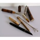 A rolled gold Parker 51 fountain pen; two treen needle cases; silver cheroot holder, swizzle stick