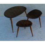 A nest of three Ercol pebble tables and matching coffee table (diam. 74 cm), all with blue labels,