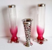 An Edwardian silver pierced vase of trumpet form with ruby glass liner and etched seaweed decoration