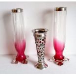 An Edwardian silver pierced vase of trumpet form with ruby glass liner and etched seaweed decoration