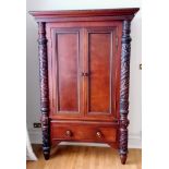 A Ralph Lauren Polo flame mahogany armoire with twin doors revealing a shelved interior, carved