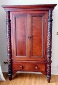 A Ralph Lauren Polo flame mahogany armoire with twin doors revealing a shelved interior, carved