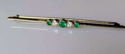 An emerald and diamond 5-stone brooch on white metal, unmarked, 7 cm, test for high quality gold,