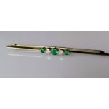 An emerald and diamond 5-stone brooch on white metal, unmarked, 7 cm, test for high quality gold,