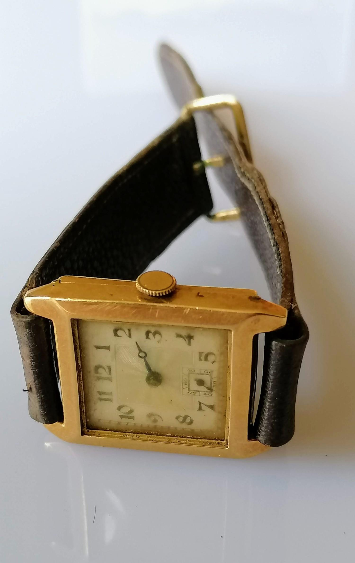 An early 20th century 18ct gold-cased tank watch with Arabic numerals, hallmarked for London, 1929