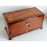 A Georgian mahogany and rosewood crossbanded tea caddy with ivory escutcheon, fitted interior with