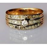 An Art Deco diamond and gold ring with triple-split shank, pave-setting with old-cut and central