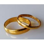 Two 22ct gold wedding bands, 5mm, 2mm, both size O and hallmarked, 6.89g