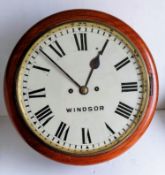 A Victorian mahogany circular wall clock with white dial, 30 cm, Roman numerals, fusee mechanism,