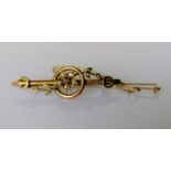 An Edwardian yellow gold brooch with garnet and seed pearl decoration, 45mm, stamped, 2.94g