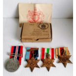 A WW2 medal group and three other medals without ribbons