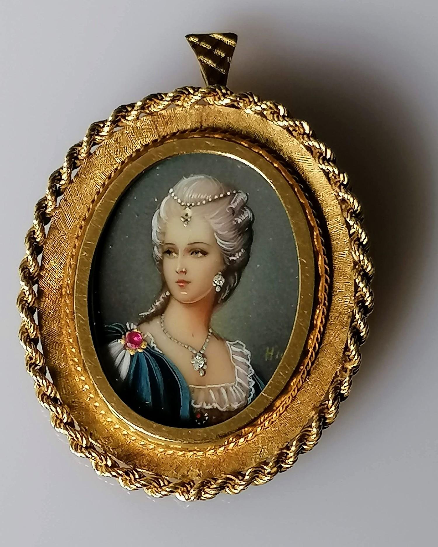 An Italian 18ct yellow gold-framed oval miniature portrait of a lady, indistinctly signed, stamped