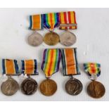 An assortment of WW1 medals, mostly individual