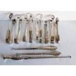 An assortment of nine silver sugar tongs, mostly George III, GIV with bright-cut decoration; various