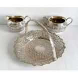 A colonial Indian silver two-handled sugar bowl, matching cream jug and tongs stamped silver and a