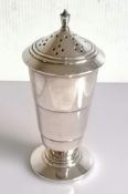 An Art Deco silver sugar caster with a conical top, stepped body, lined interior, on a splayed