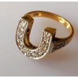 A mid-century yellow and white gold horseshoe-shape ring with pave-set diamond decoration,
