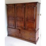 A Harrods Royal Oak Furniture three-door cupboard with drawers under, fitted for hanging, 196 h x