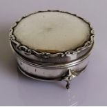 A George V silver trinket box with hinged lid and lined interior on three cabriole legs by Robert