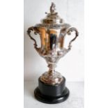 A Victorian two-handled silver trophy cup and cover with profuse rococo decoration by Edward Ker