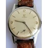 A 1960's men's Omega manual wristwatch with baton and Arabic numeral markers, subsidiary seconds