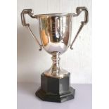 An Art Deco silver two-handled trophy cup on a spreading foot by William Neale & Son Ltd.,