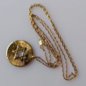 An artisan gold Star of David pendant and chain (catch damaged), both stamped 14k, 8.61g