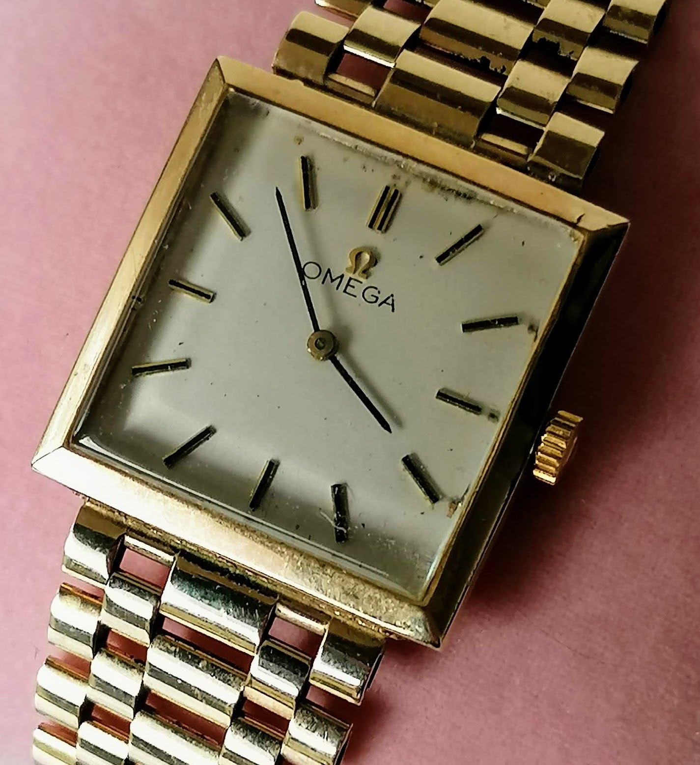 A mid-20th century Omega manual men's wristwatch with 9ct yellow gold bracelet strap, square dial,