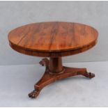 A recently restored George IV-style rosewood circular breakfast table on a gun barrel support,