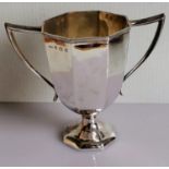 A George V silver octagonal, two-handled trophy cup with reeded decoration to rim by C.P & Co,