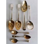 A George III silver fruit or berry spoon by William Bateman, 1815, 22 cm, a similar pair by Holland,