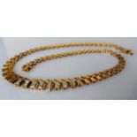 A mid-century bib necklace with graduating links with diamond decoration, 44 cm, indistinct marks,