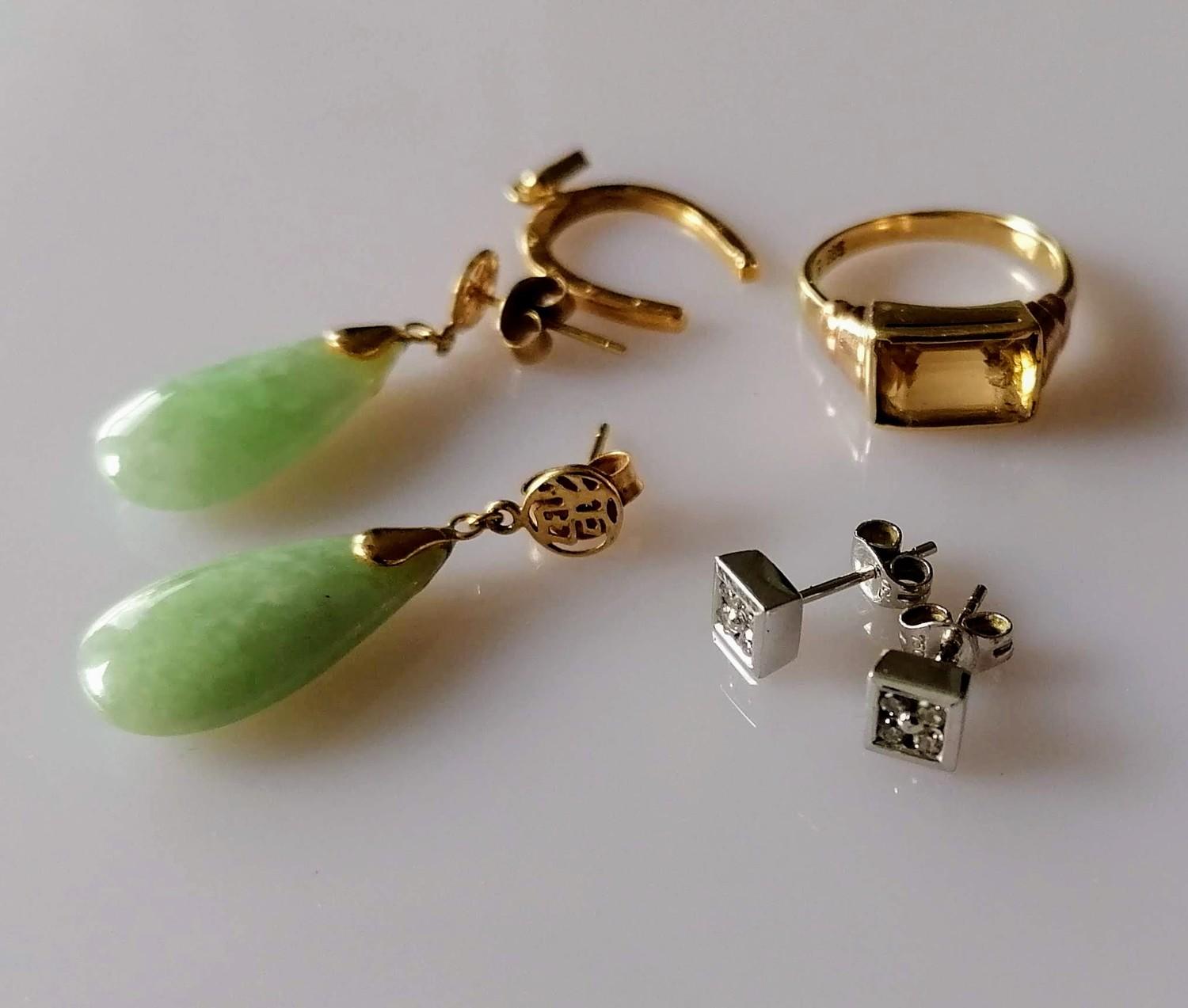 A pair of 18ct white gold earrings, each with four brilliant-cut diamonds; a baguette-cut citrine (