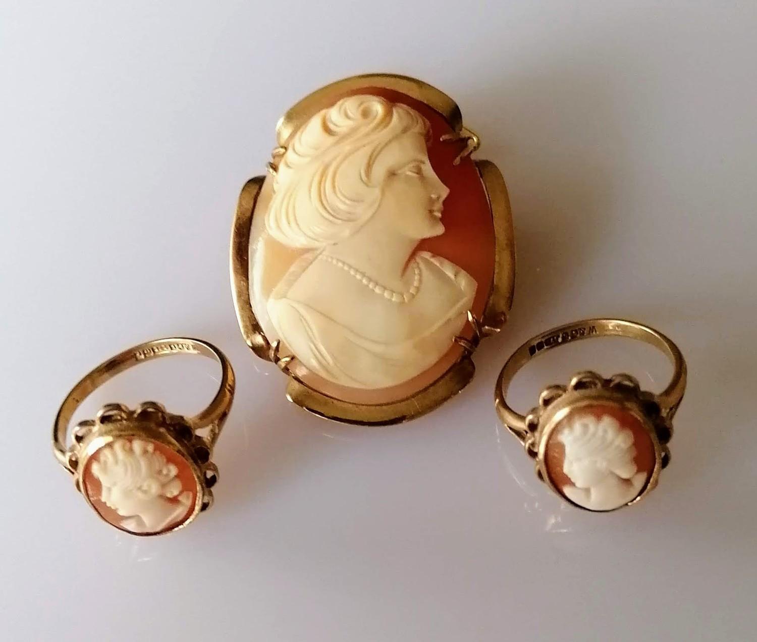 An oval cameo brooch, unmarked with a pair of matching cameo rings, hallmarked, sizes M1/2, O1/2,