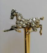 An equine brooch with old-cut diamonds mounted on a yellow metal frame, unmarked, 55mm, 3.8g