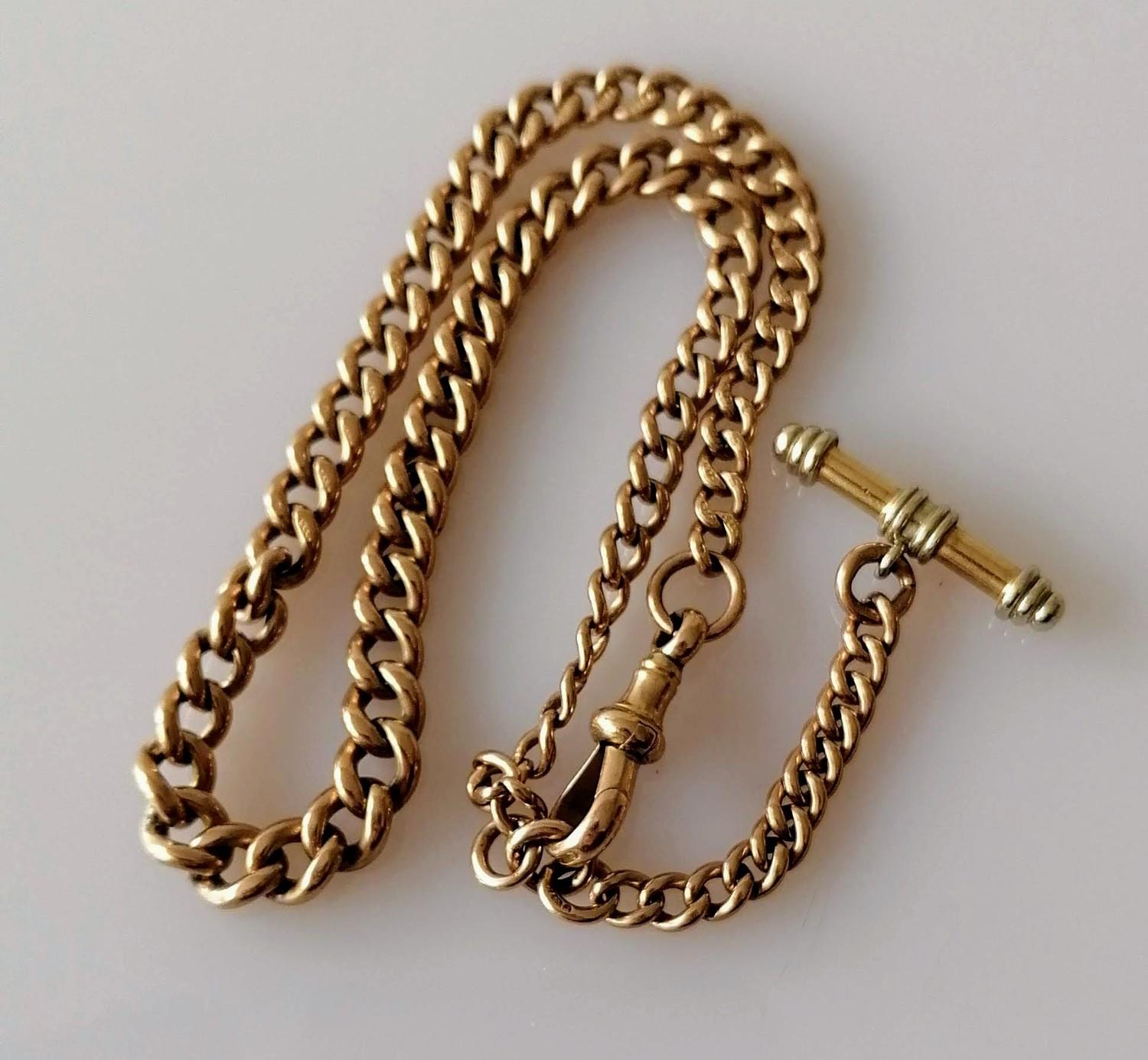 A late Victorian rose gold curb-link Albert chain with T-bar, each link and clasp stamped 9ct/375,