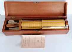 A cased Stanley Fuller spiral slide rule calculator with wood fittings, serial no. 989/97, 43cm