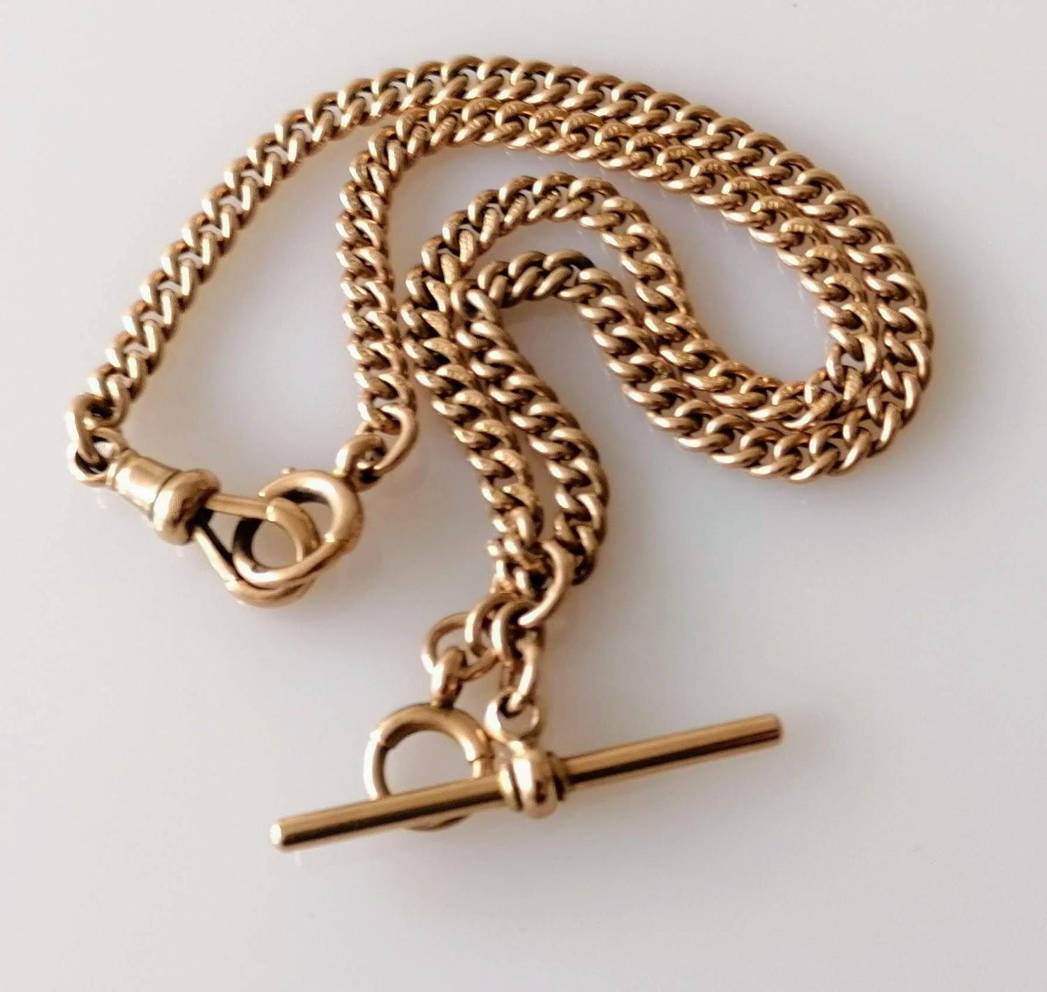 A 19th century rose gold curb-link Albert chain with conforming T-bar and clasp, maker M&M, all