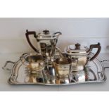 An Art Deco silver four-piece tea/coffee service with egg and dart decoration to rim, faceted sides,