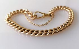 A George V rose gold curb-link bracelet, each link stamped 9/375, jump ring hallmarked Birmingham