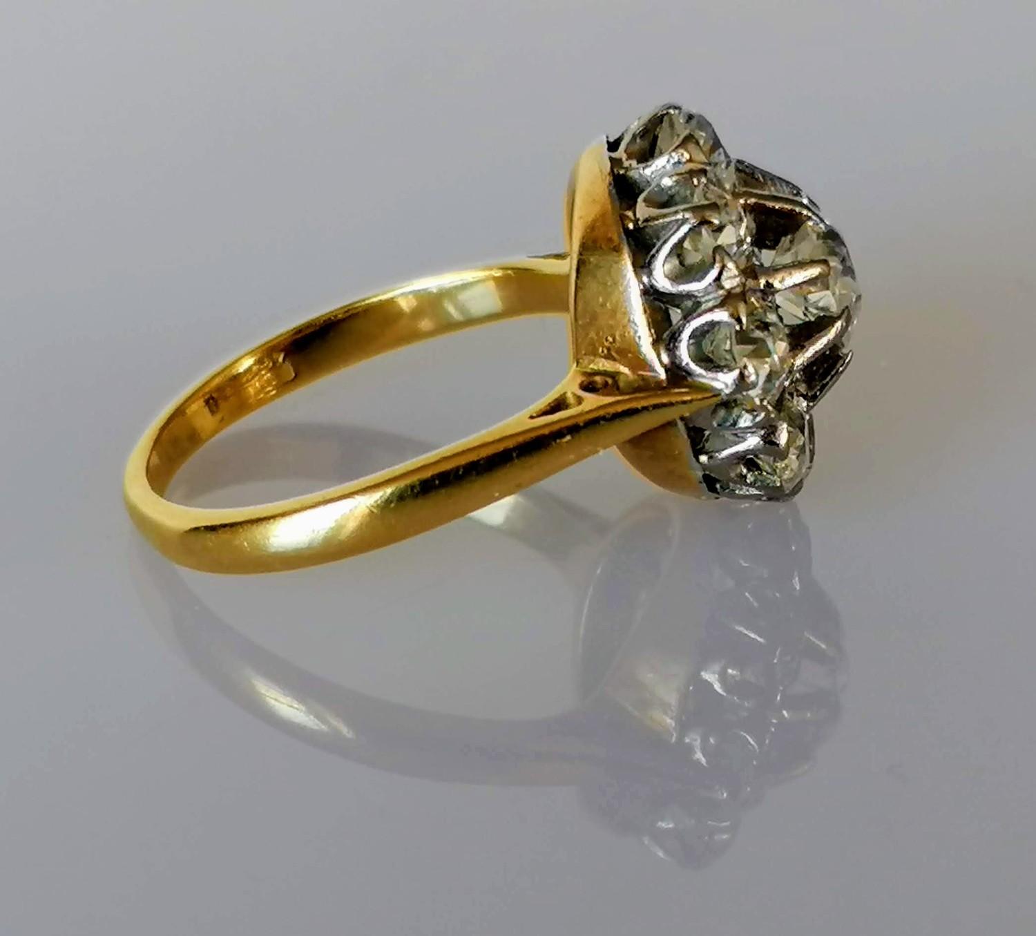 A diamond cluster ring on a claw-set yellow and white 18ct gold setting: the central old European- - Image 4 of 8