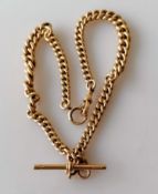 A Victorian rose gold curb-link Albert chain with conforming T-bar and clasp, maker DB, all links